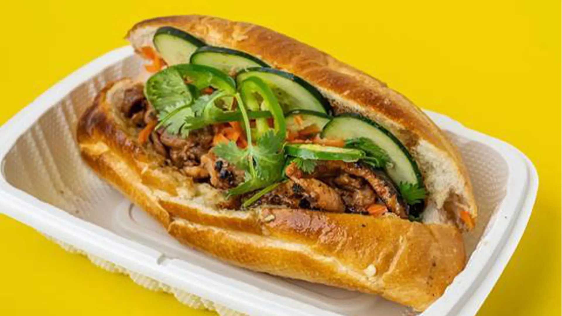 BBQ chicken banh mi with veggies at Big Boss Banh Mi, a Vietnamese Restaurant in Houston