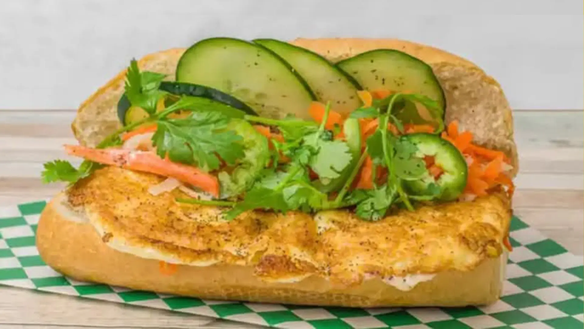 Banh mi with fried egg, veggies, cilantro at Big Boss Banh Mi, a Vietnamese Restaurant in Houston