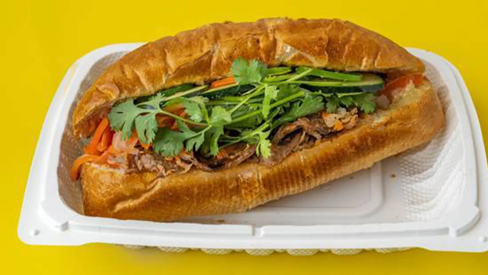 Grilled pork banh mi with veggies, cilantro at Big Boss Banh Mi, a Vietnamese Restaurant in Houston