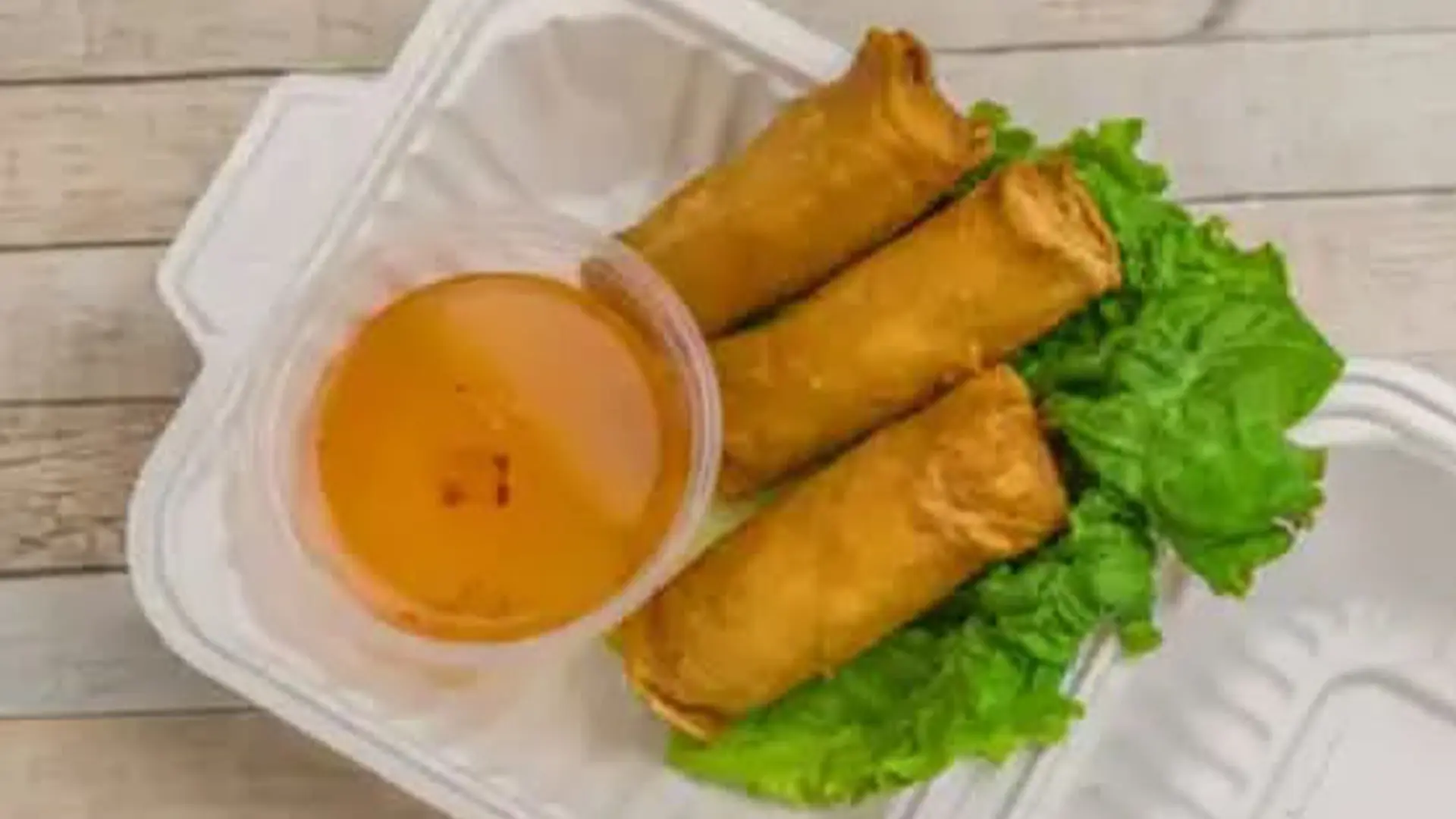Vietnamese egg rolls with lettuce, dip at Big Boss Banh Mi, a Vietnamese Restaurant in Houston